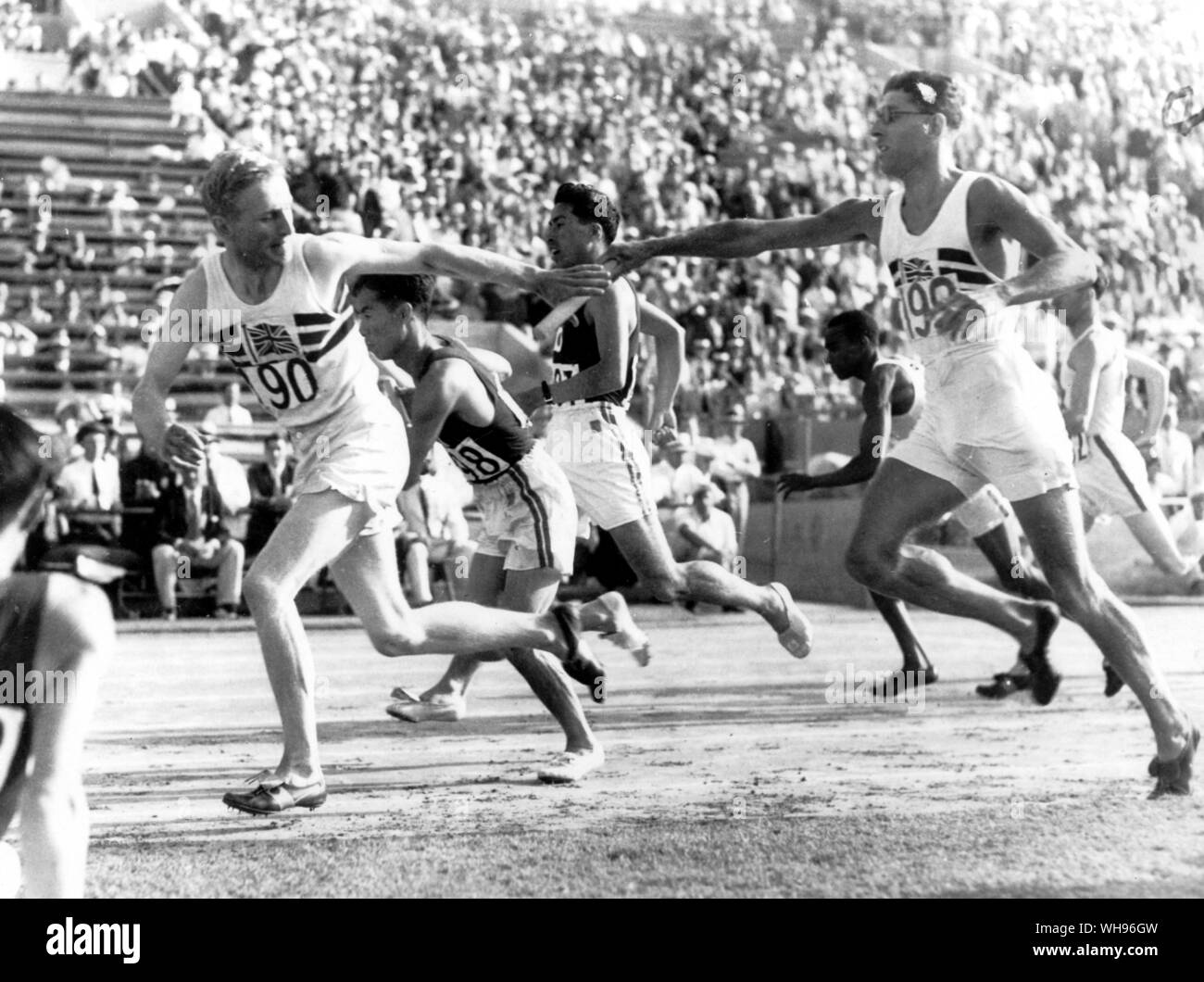 the-japanese-and-british-teams-are-shown-passing-the-baton-in-the-400-metre-relay-heats-left-to-right-lord-burghley-great-britain-oki-japan-masuda-japan-thomas-hampson-great-britain-japan-won-the-relay-heat-olympic-games-los-angeles-1932-WH96GW.jpg