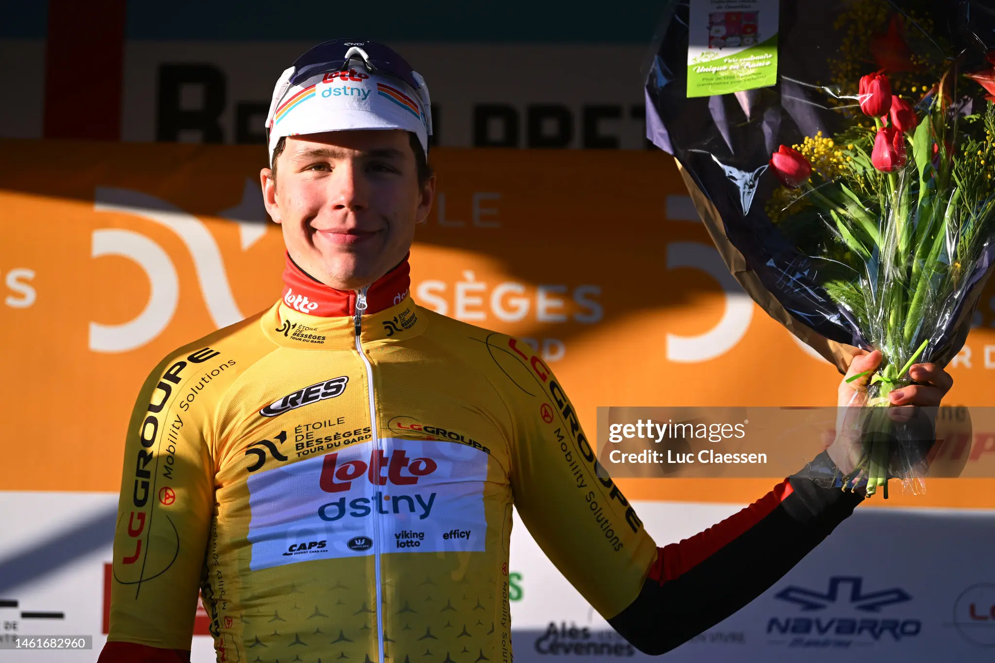 arnaud-de-lie-of-belgium-and-team-lotto-dstny-celebrates-at-podium-as-yellow-points-jersey.webp